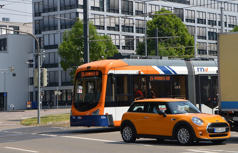 Bus and car on street